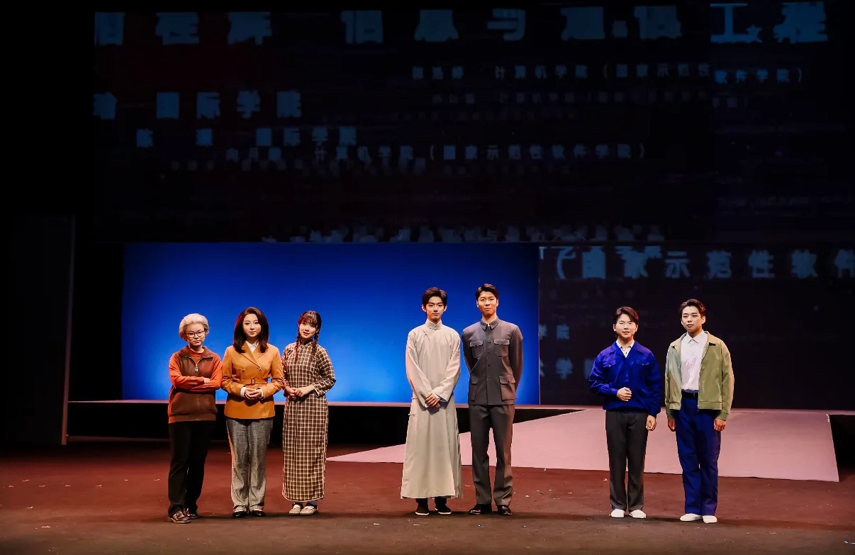 Seven performers standing in a row facing the audience in Walking with Light
